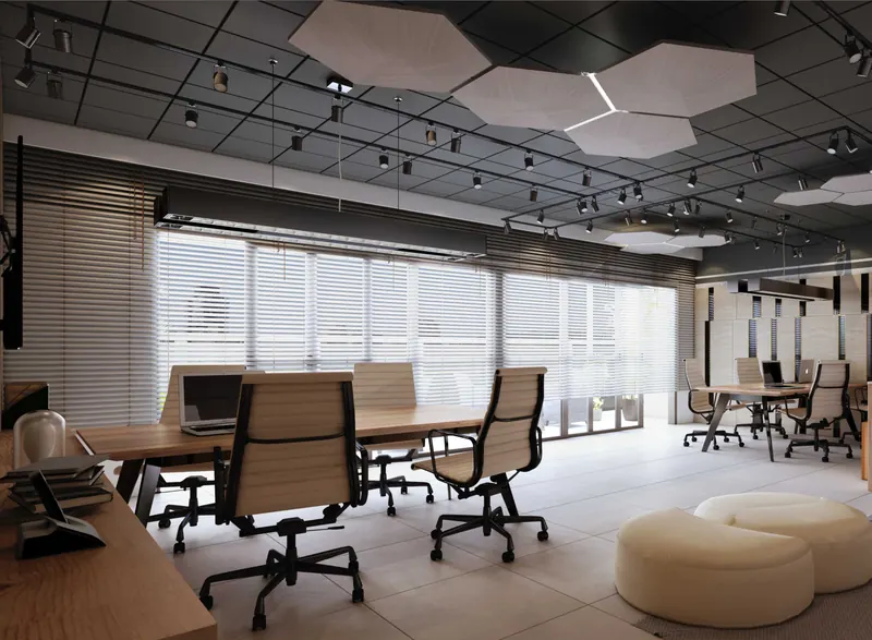 Cowork com mesas de trabalho, cadeiras ergonômicas e pufes