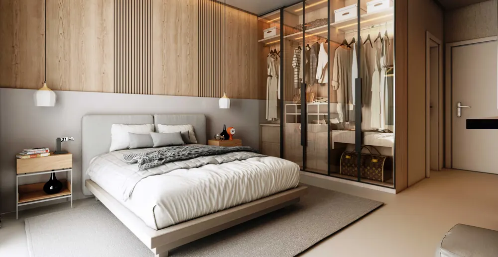 Suíte do studio com painel ripado, cama de casal e closet com portas de vidro